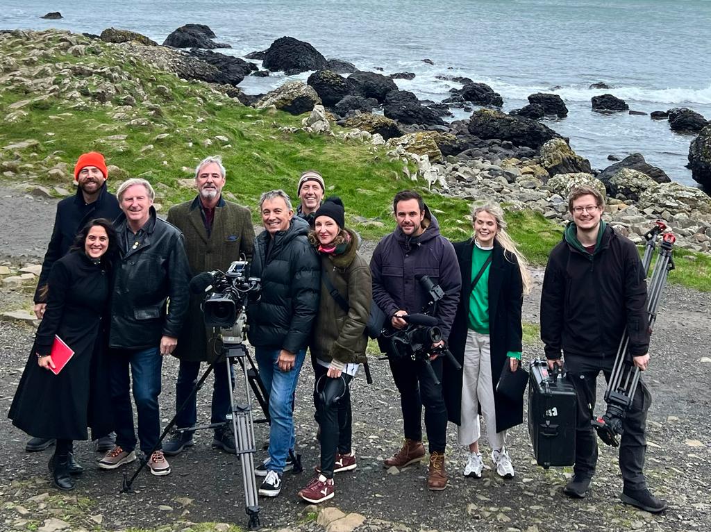 Television production crew & talent on location, Giant's Causeway, N.Ireland.